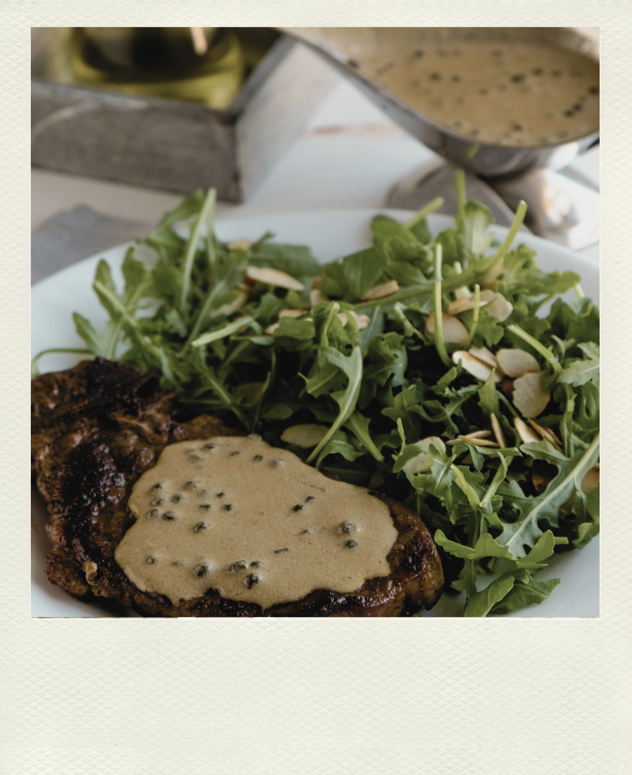 Elegant French Bistro Fare: Steak with Green Peppercorn Sauce