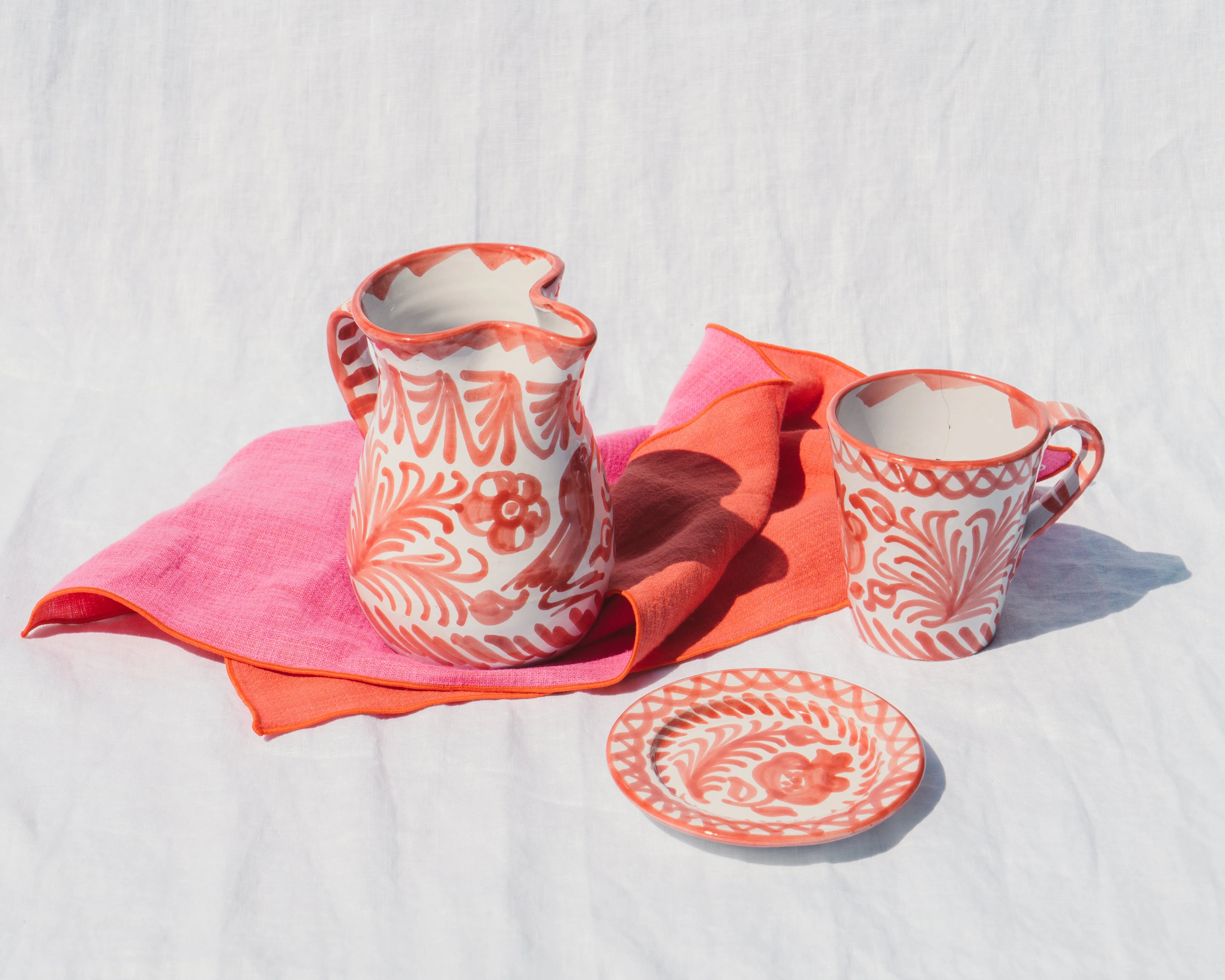 Small pitcher with hand painted designs