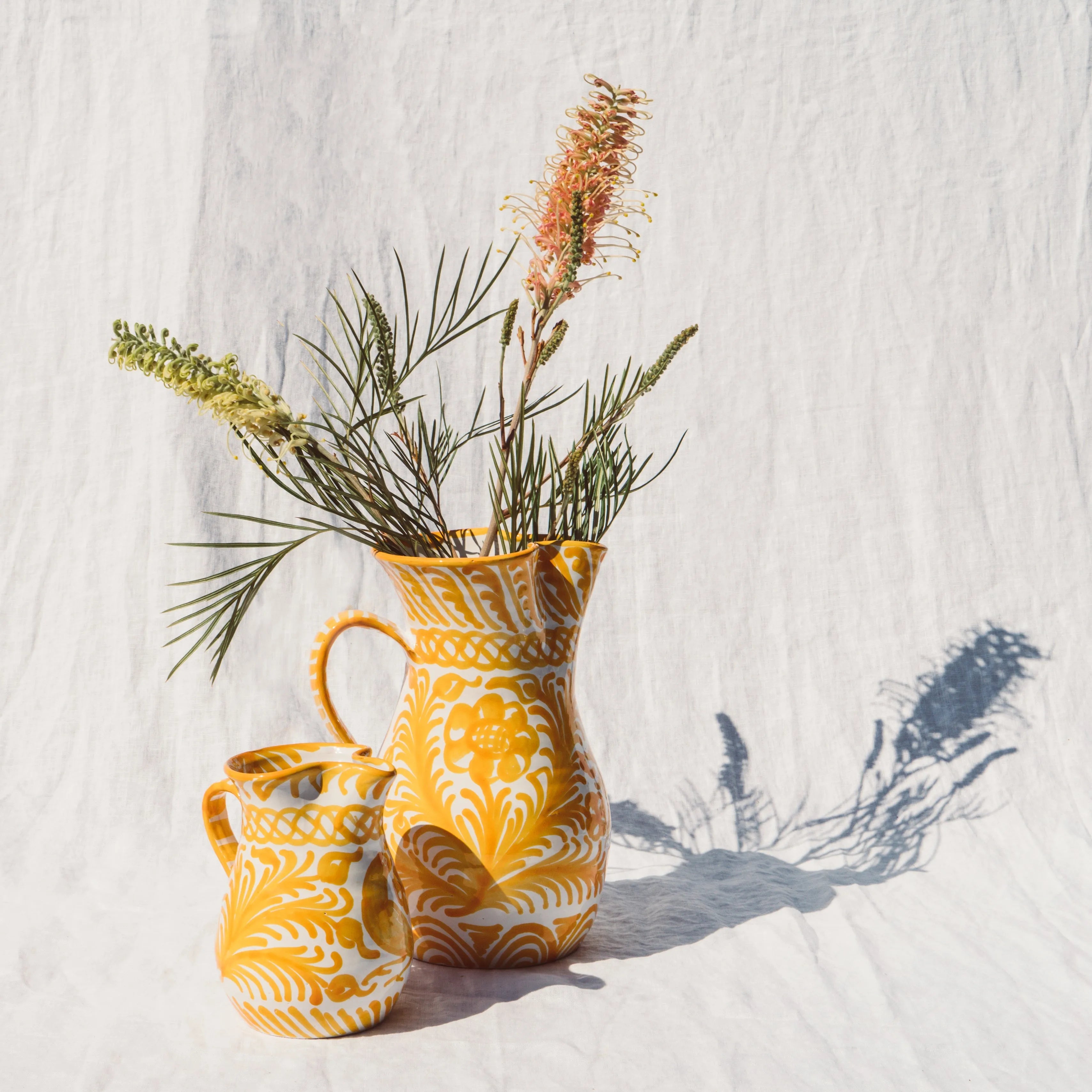 Small pitcher with hand painted designs