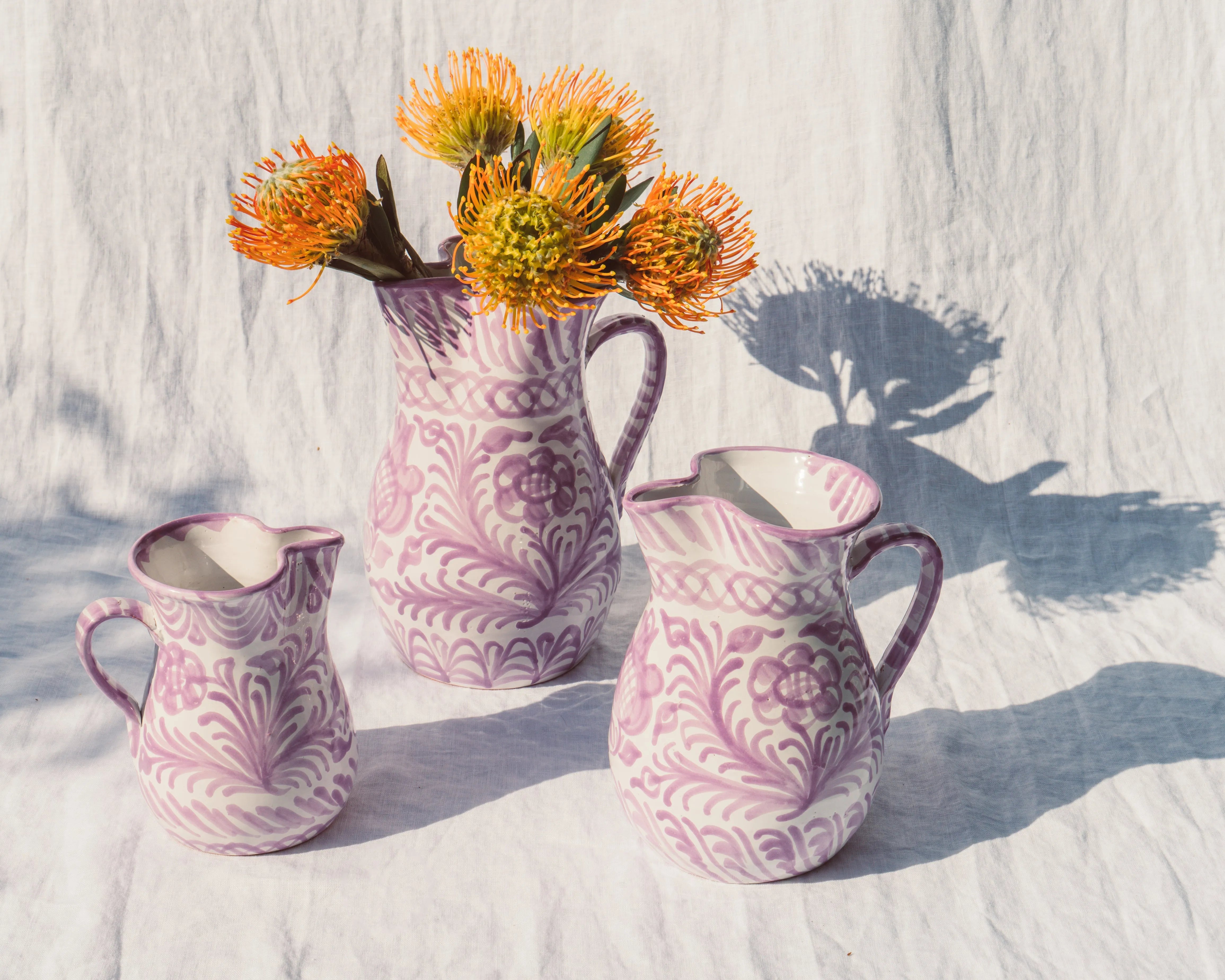 Small pitcher with hand painted designs