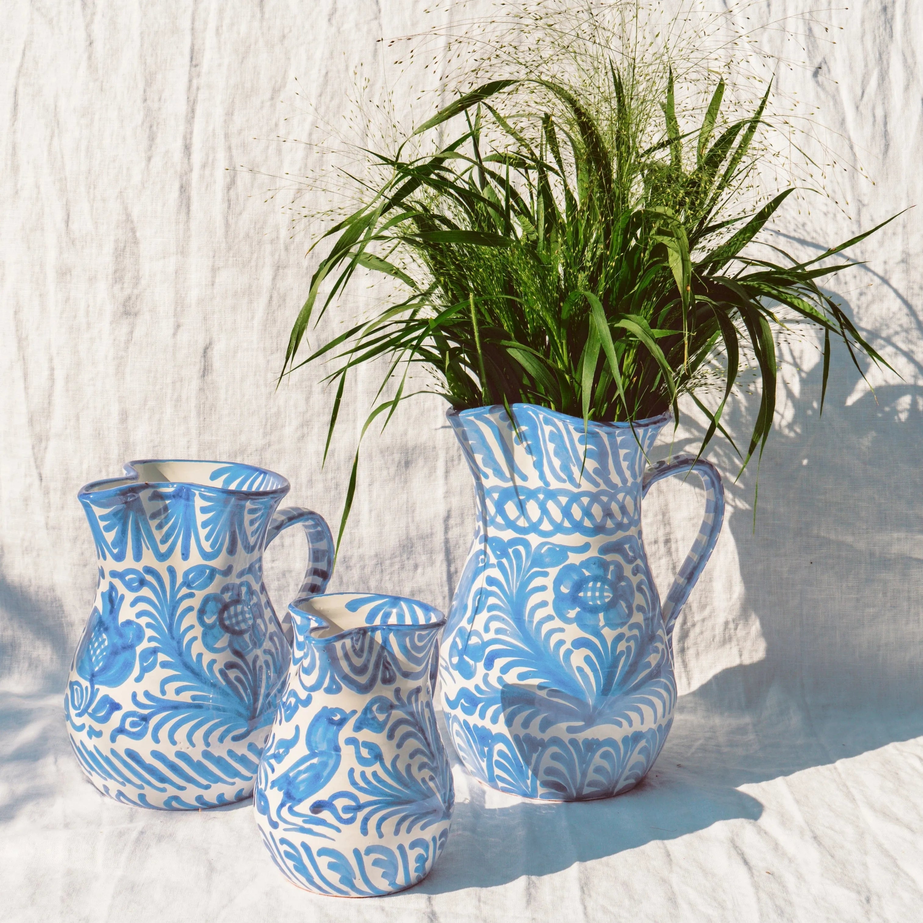 Large pitcher with hand painted designs