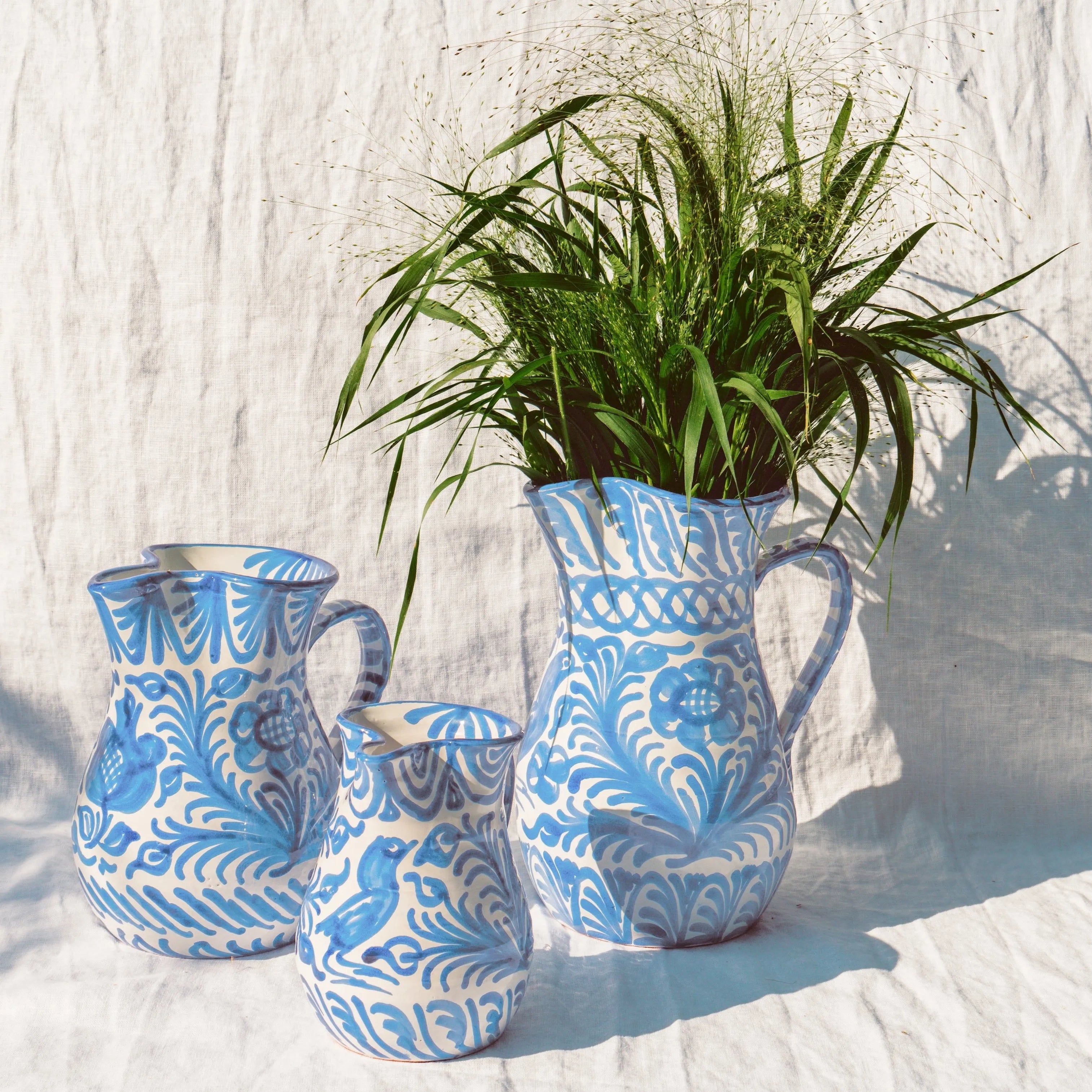 Medium pitcher with hand painted designs