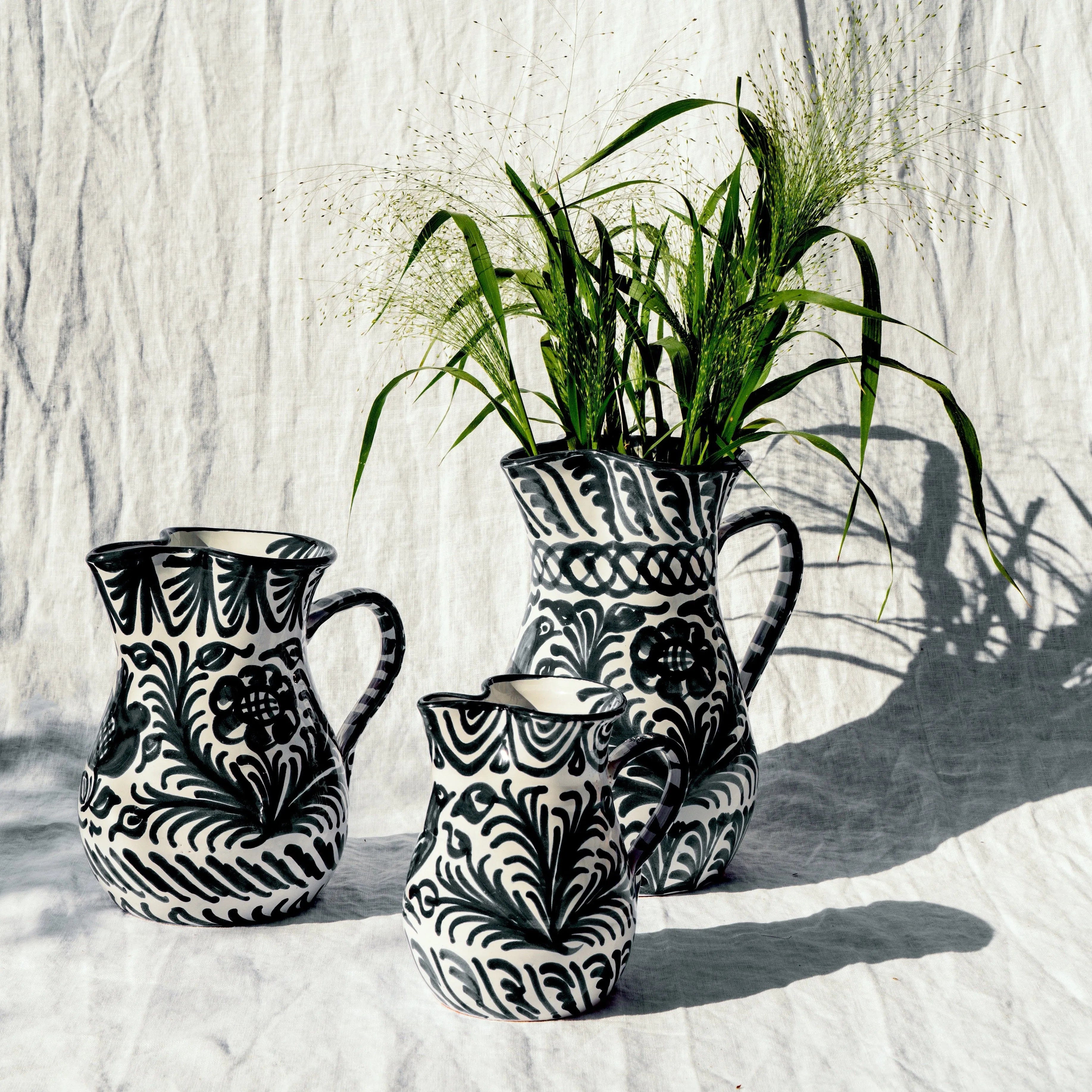 Large pitcher with hand painted designs