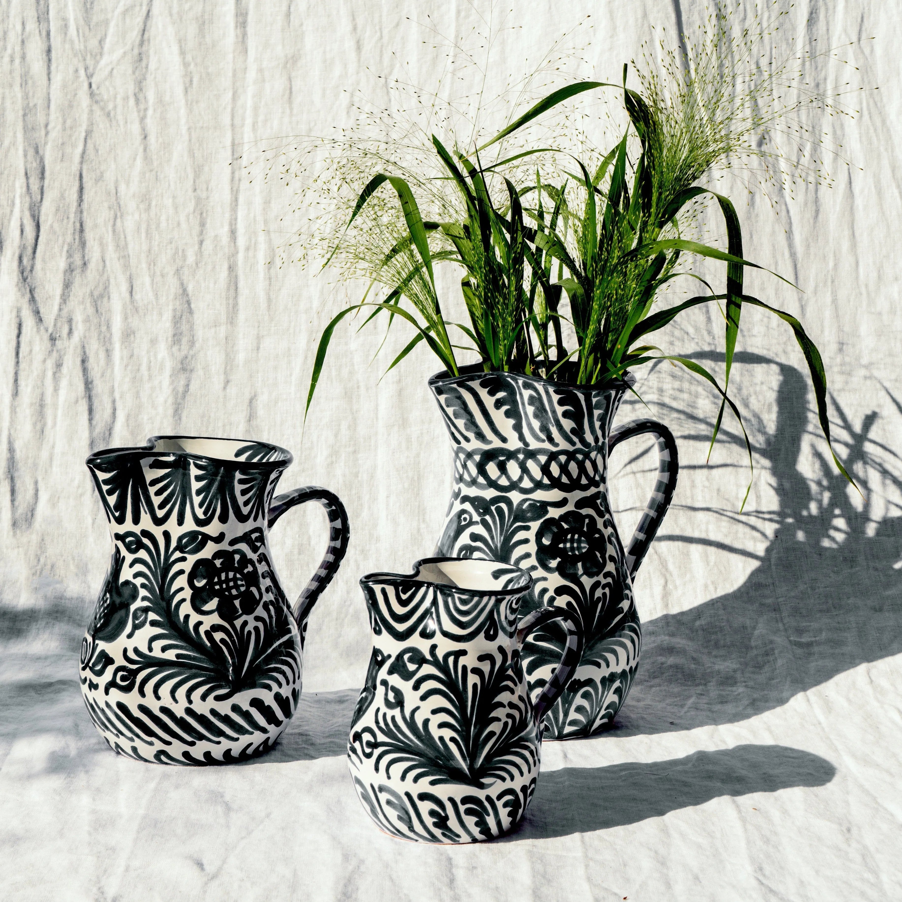 Small pitcher with hand painted designs