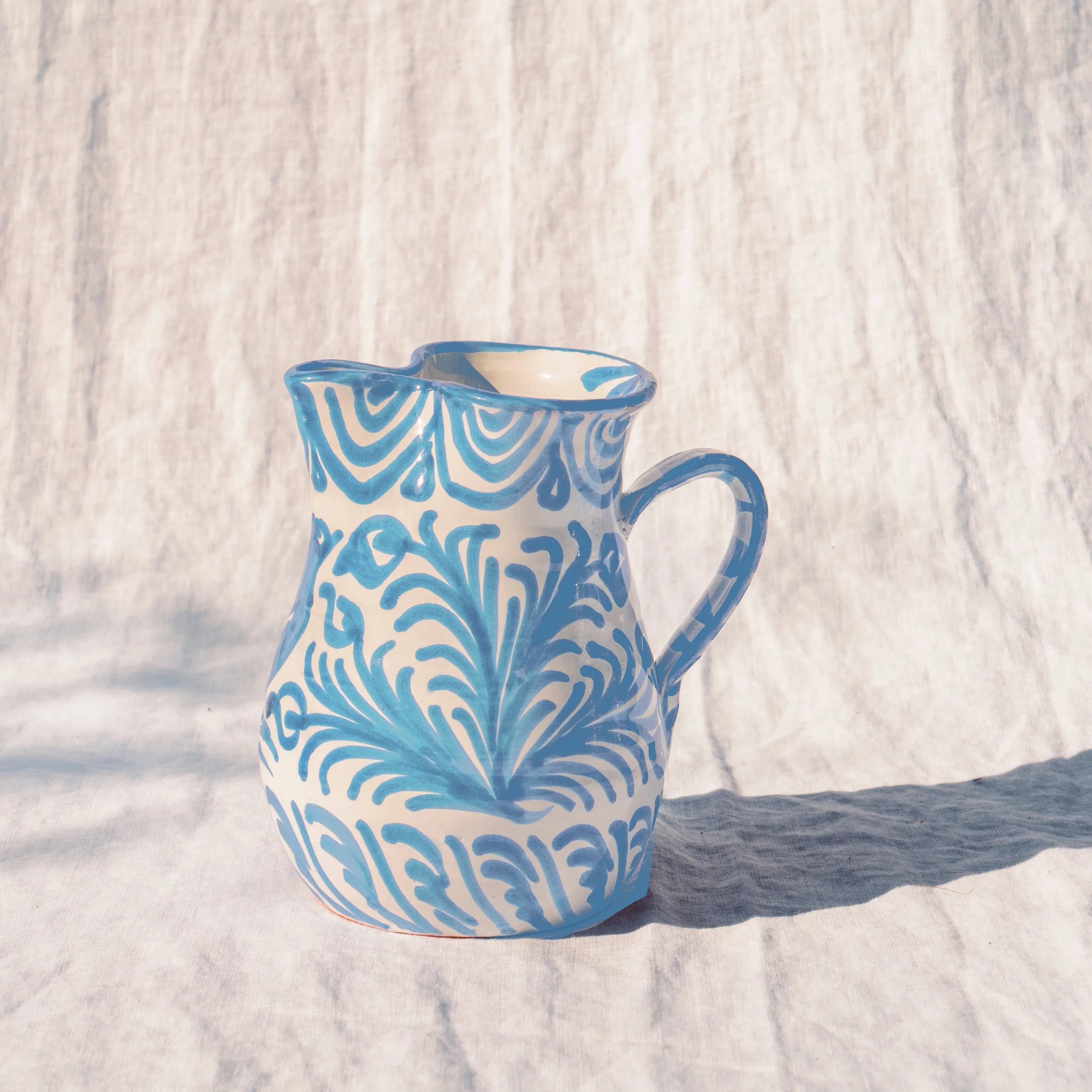 Small pitcher with hand painted designs