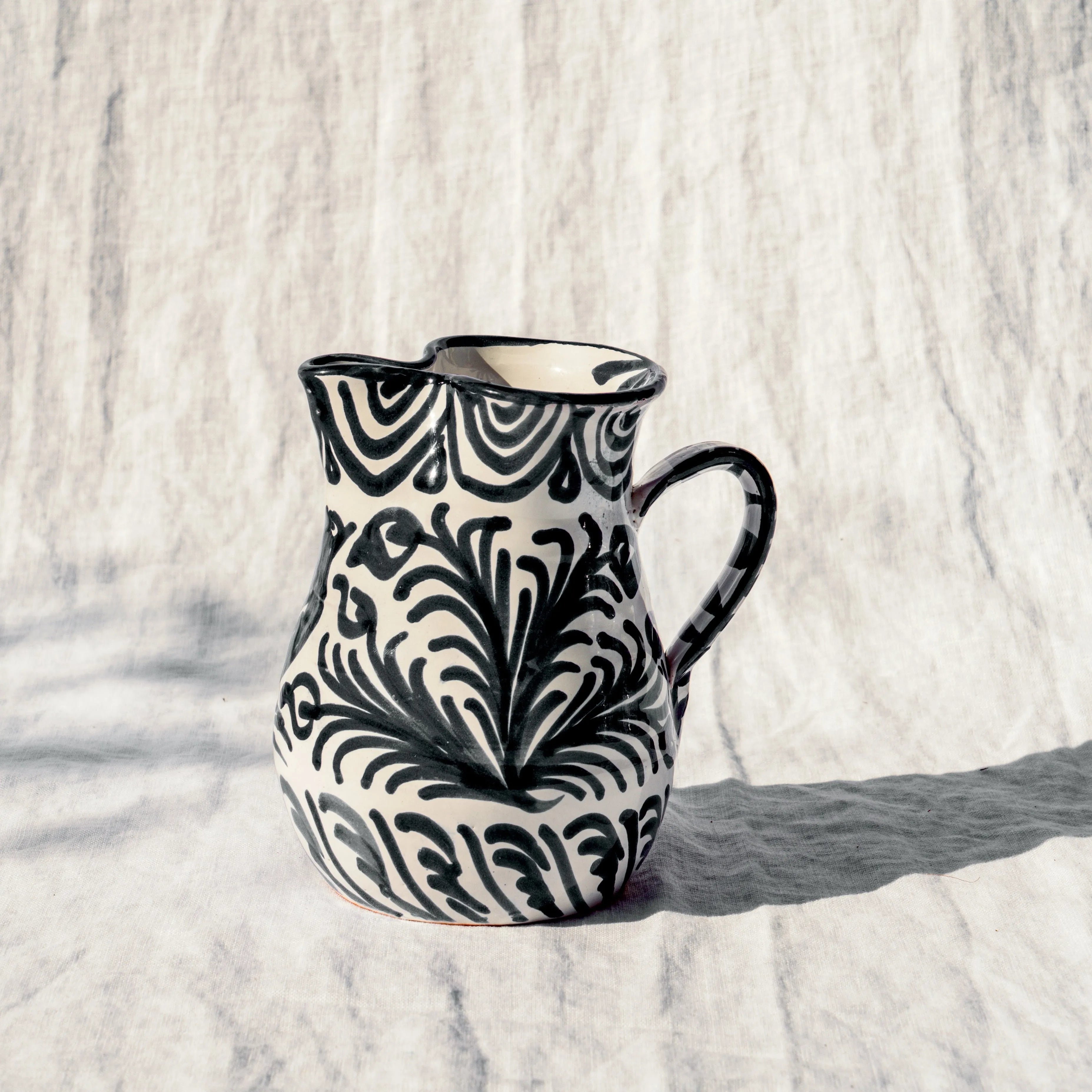 Small pitcher with hand painted designs