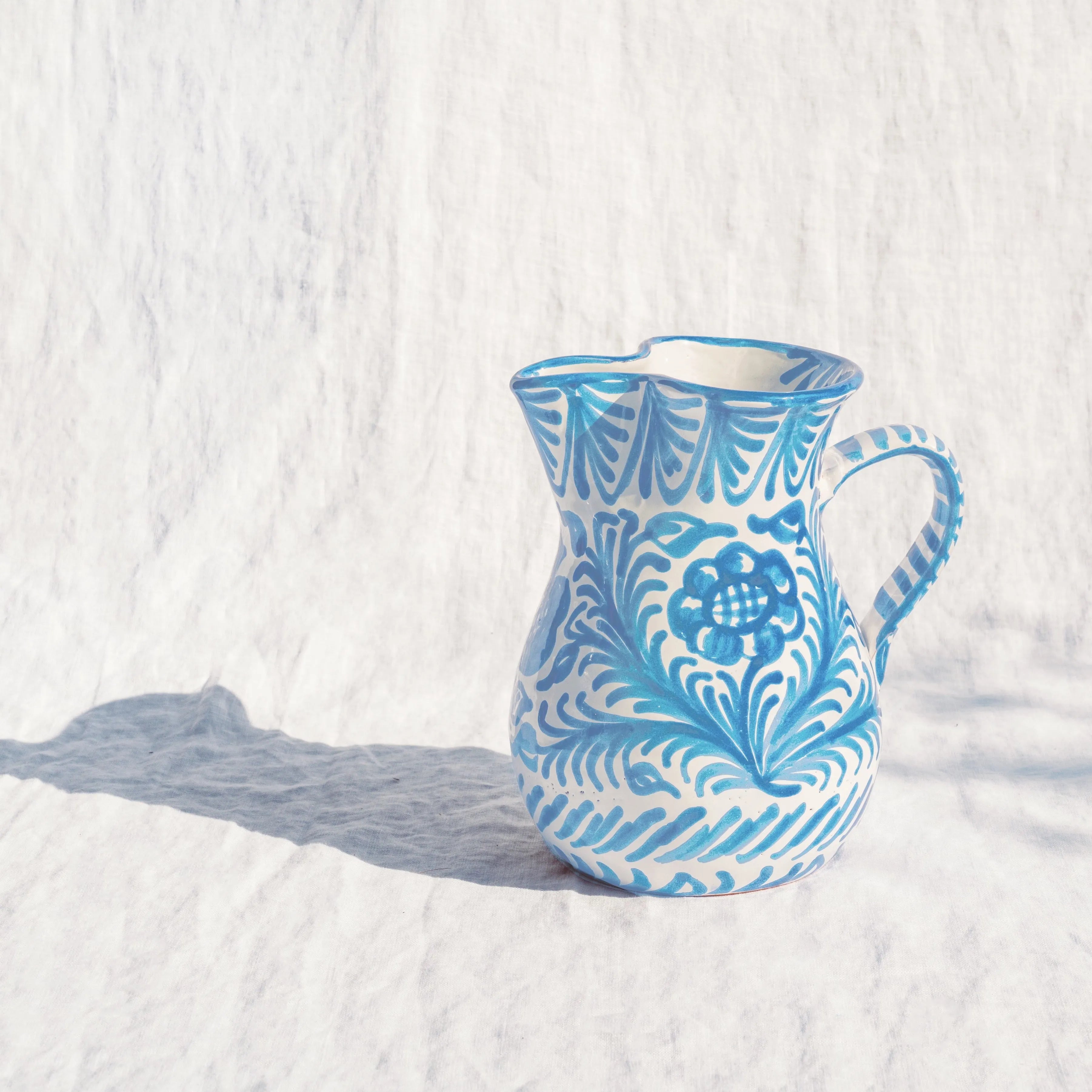 Medium pitcher with hand painted designs