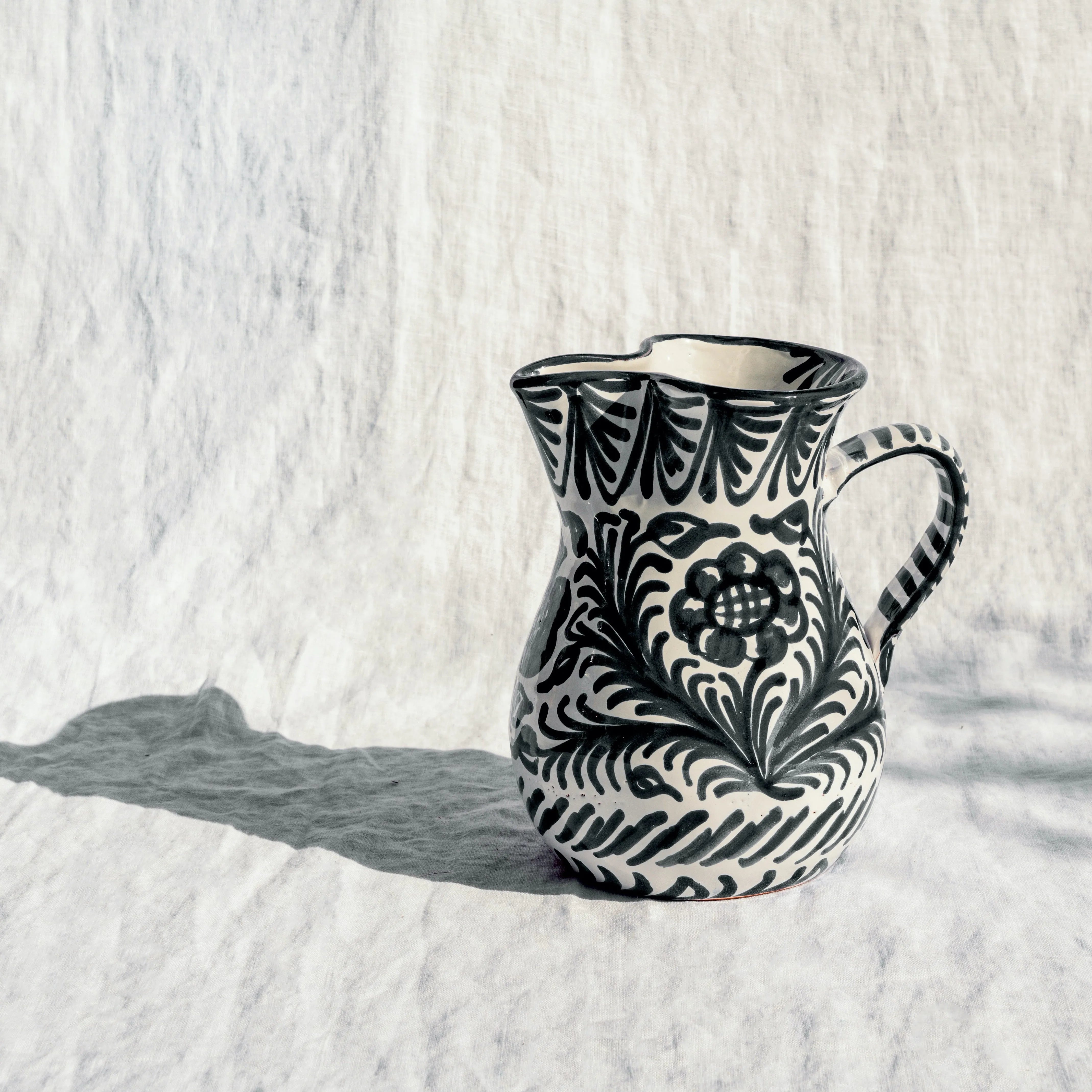 Medium pitcher with hand painted designs