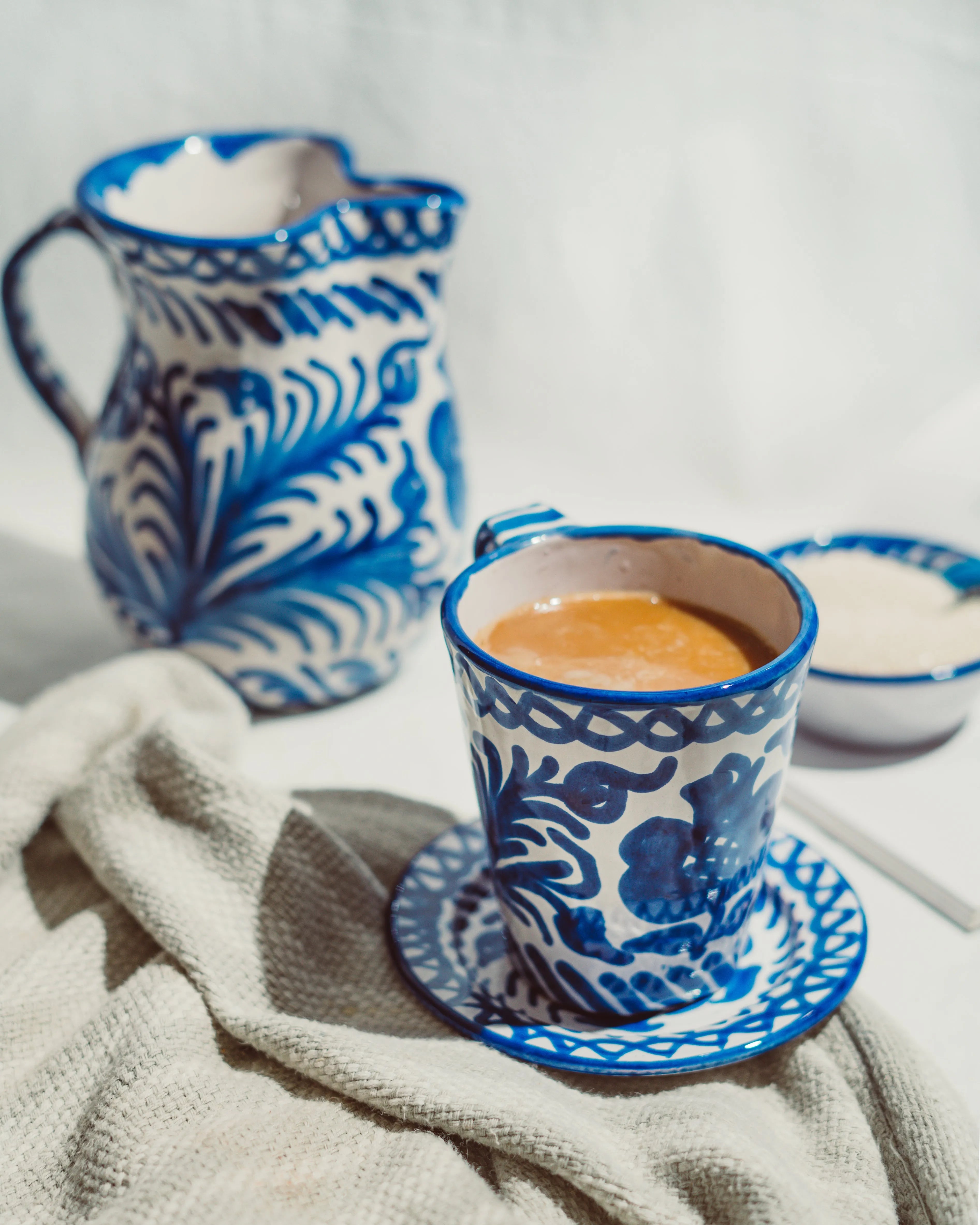 Small pitcher with hand painted designs