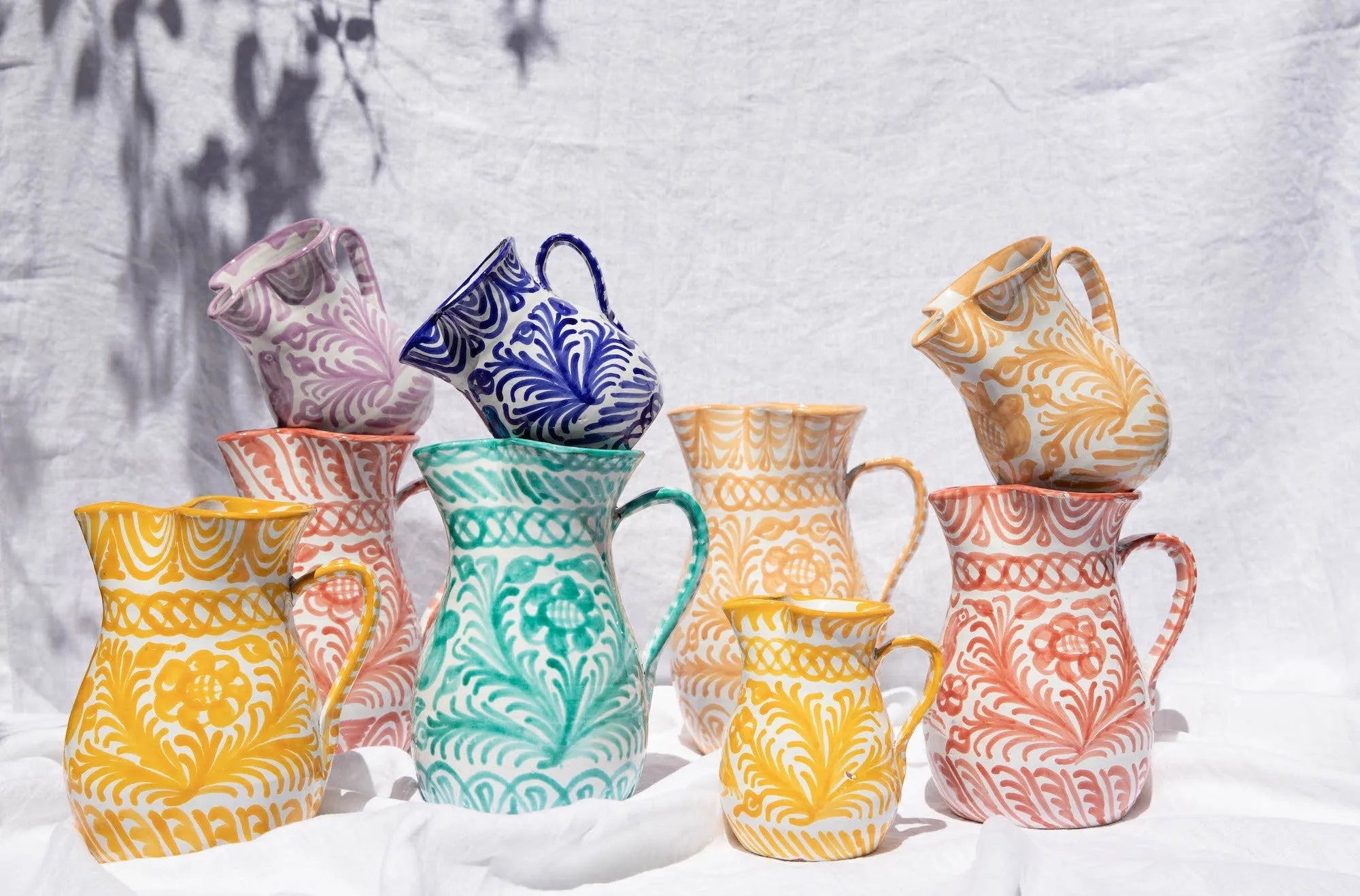 Medium pitcher with hand painted designs