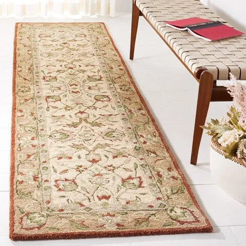 Antiquity Wool Rug in Rust and Ivory